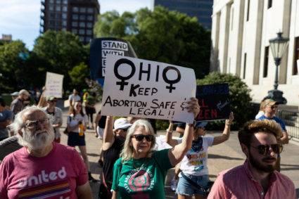 An abortion rights protester holds a sign to keep abortion safe in Ohio at a rally in Columbus, Ohio, after the United States Supreme Court ruled in the Dobbs v Women's Health Organization abortion case, overturning the landmark Roe v Wade abortion decision, June 24, 2022. Photo by Megan Jelinger/REUTERS
