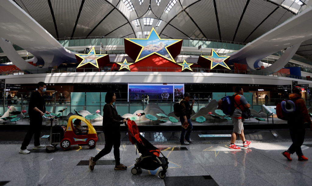 FILE PHOTO: Travellers at Beijing Daxing International Airport
