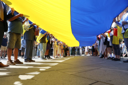 People hold a giant Ukrainian flag during a march of solidarity to mark Ukraine Independence Day in Belgrade, Serbia, August 24, 2023. Photo by Zorana Jevtic/REUTERS