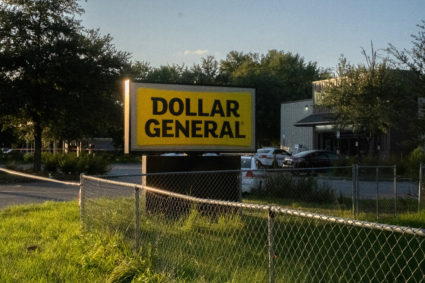 Police investigators continue to work at a Dollar General store after a shooting in Jacksonville