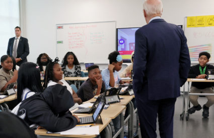 U.S. President Joe Biden and first lady Jill Biden (not pictured) greet children on their first day back to school at Eliot-Hine Middle School in Washington, U.S., August 28, 2023. Photo by Leah Millis/REUTERS
