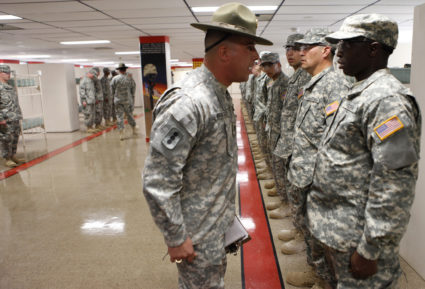 A drill sergeant scolds one of his recruits during basic training at the Fort Sill Army Post in Fort Sill
