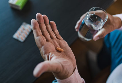 Mature Man Taking Medication
