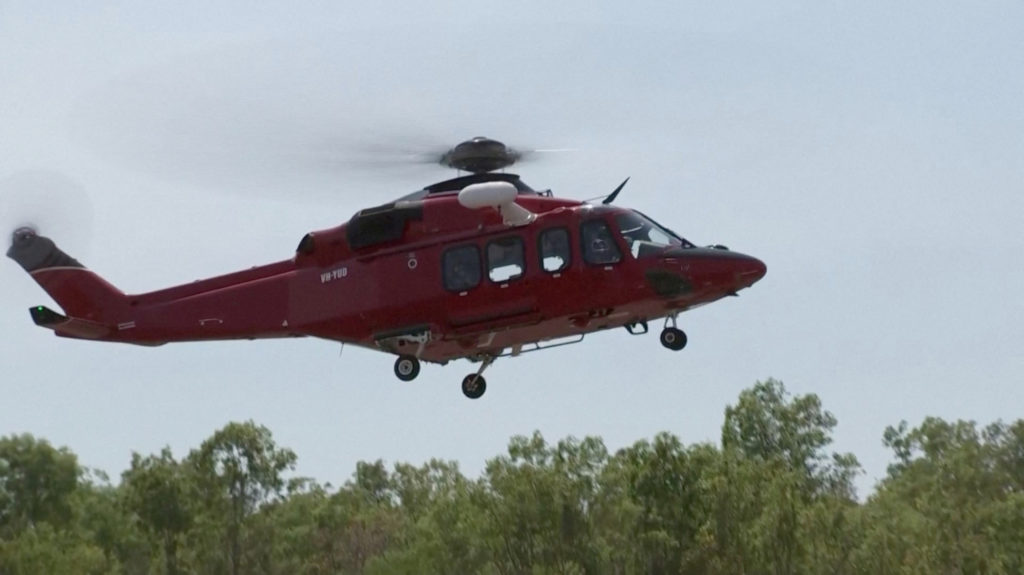 A helicopter takes off following U.S. military aircraft crash in Darwin