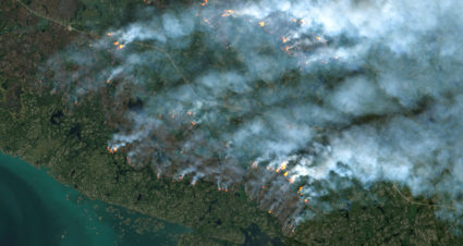 FILE PHOTO: A satellite image shows wildfires burning near Yellowknife