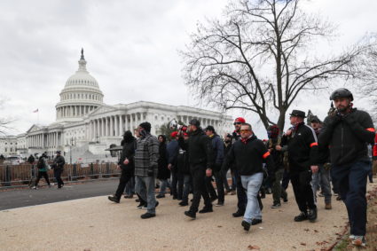 Members of the the far-right group Proud Boys march to the U.S. Capitol Building in Washington