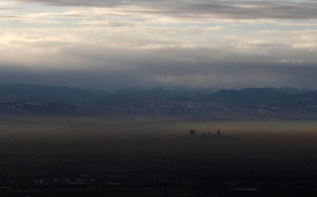 FILE: The Rocky Mountains are pictured as a layer of air pollution hangs over Denver, Colorado