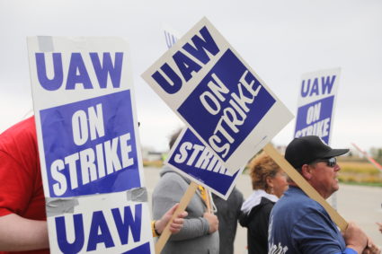 Striking members of the United Auto Workers (UAW) picket at the Deere &amp; Co farm equipment plant before a visit by U.S....