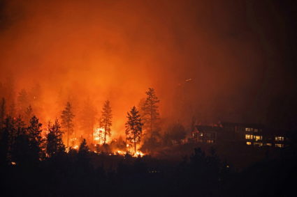 The McDougall Creek wildfire burns at the edge of West Kelowna