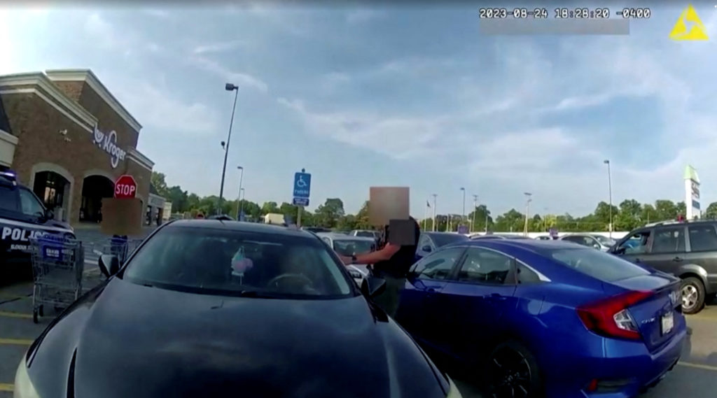 Screen capture obtained from a body camera footage showing an officer fatally shooting a pregnant Black woman in the parki...