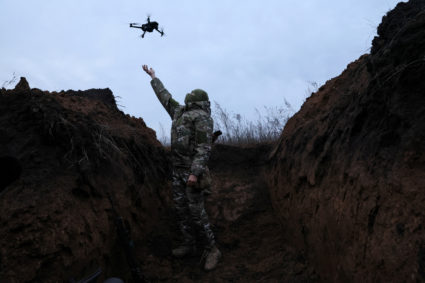 "Ghost", 24, a soldier with the 58th Independent Motorized Infantry Brigade of the Ukrainian Army, catches a drone while testing it so it can be used nearby, as Russia's invasion of Ukraine continues, near Bakhmut, Ukraine, November 25, 2022. Photo by Leah Millis/REUTERS