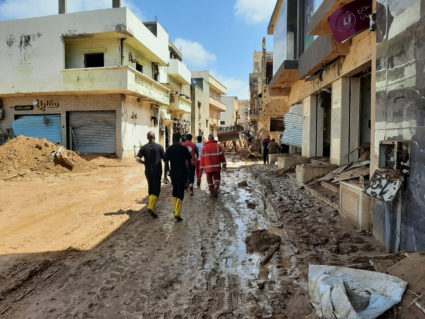 Members of Libyan Red Crescent Ajdabiya work in an area affected by flooding, in Derna