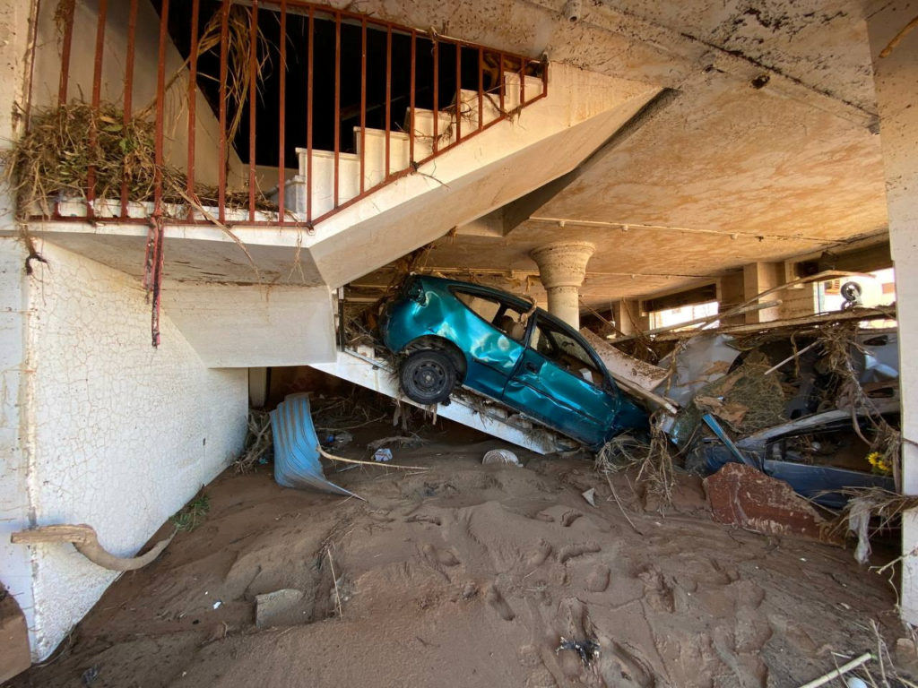 A view shows a damaged car, following a powerful storm and heavy rainfall hitting the country, in Derna