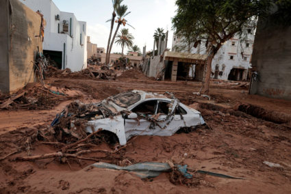 A car is submerged in mud after a powerful storm and heavy rainfall hit Libya, in Derna