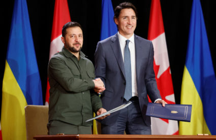 Ukraine's President Volodymyr Zelenskiy shakes hands with Canadian Prime Minister Justin Trudeau following signing a free trade agreement, in Ottawa, Ontario, Canada September 22, 2023. Photo by Blair Gable/REUTERS