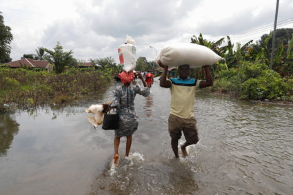 Residents wade through flood water in Obagi community, Rivers state