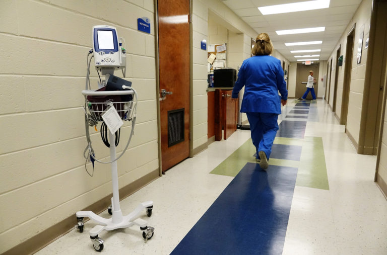 A nurse walks along the hallways of the East Arkansas Family Health Center in Lepanto