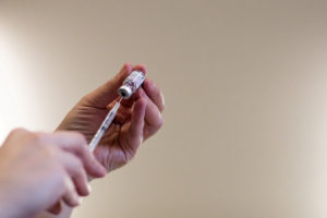 FILE PHOTO: People receive their second COVID-19 boosters in Waterford, Michigan