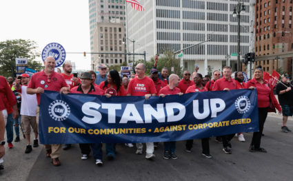 FILE PHOTO: United Auto Workers members march in the street in support of striking auto workers