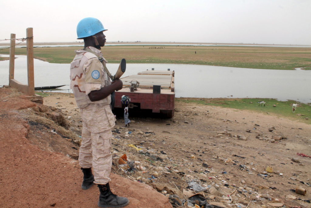A UN peacekeeper stands guard in the northern town of Kouroume, Mali May 13, 2015. Kourome is 18 km (11 miles) south of Timbuktu. Photo by Adama Diarra/REUTERS