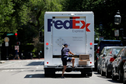 A Fedex driver delivers packages in Boston