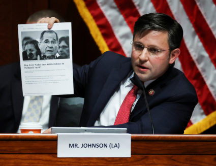 Rep. Mike Johnson (R-LA) holds up an article while questioning U.S. Attorney General William Barr during a House Judiciary Committee hearing on Capitol Hill, in Washington, U.S., July 28, 2020. Photo by Chip Somodevilla/Pool via REUTERS