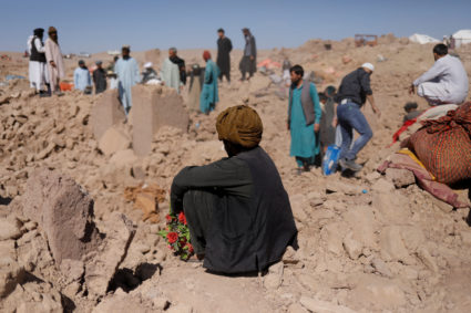 An Afghan man sits past his sister's damaged house after the recent earthquake in the district of Zinda Jan, in Herat, Afghanistan October 9, 2023. Photo by Ali Khara/REUTERS
