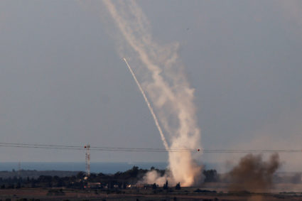 Israel's Iron Dome anti-missile system launches defensive rockets to intercept rockets launched from the Gaza Strip toward...