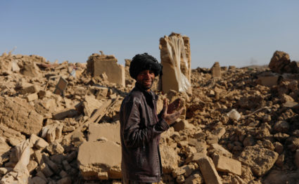 An Afghan man cries next to his house after the recent earthquake in Chahak village