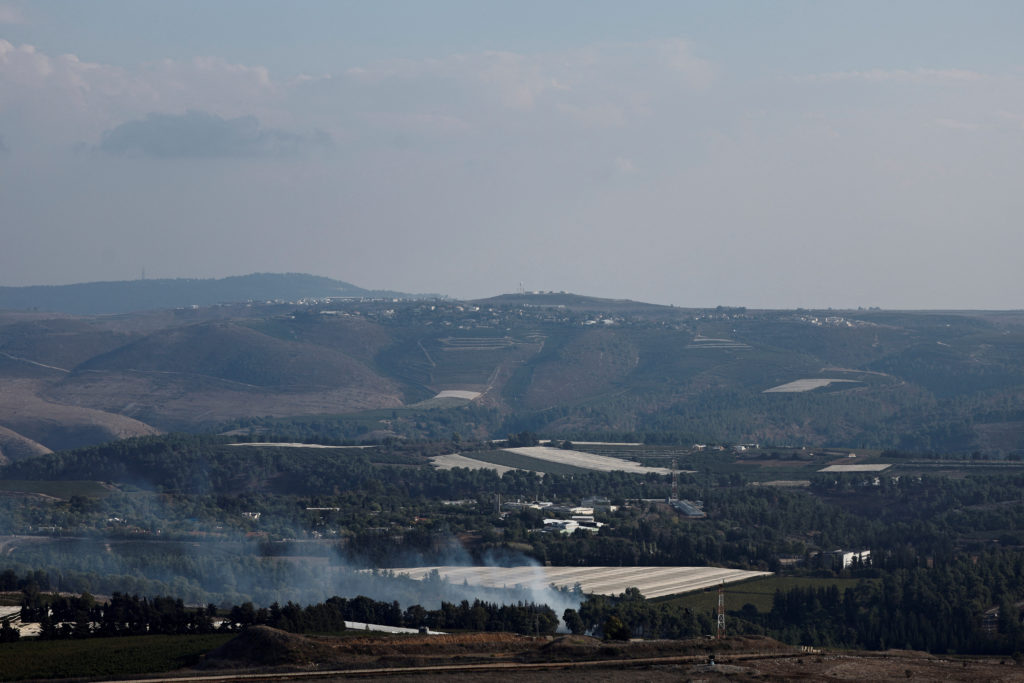 Smoke rises from the Israeli side, as seen from Maroun al-Ras near the Lebanese-Israeli border, in southern Lebanon, Octob...