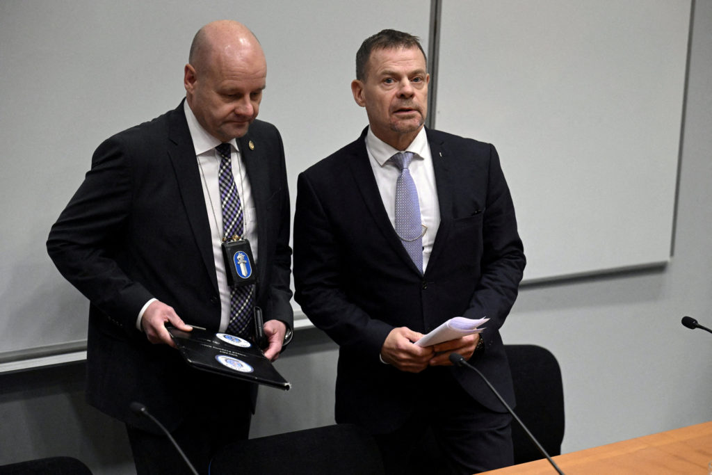 Detective Superintendent Risto Lohi and Director Robin Lardot (R) of the National Bureau of Investigation NBI of Finland a...