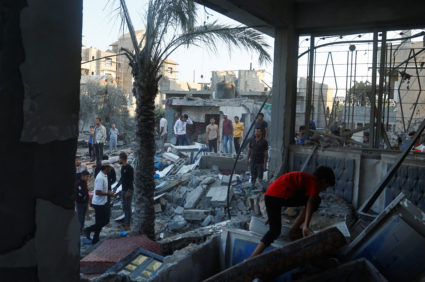 A Palestinian walks through the rubble of a house destroyed in Israeli strikes amid the conflict with Israel in Khan Younis, in the southern Gaza Strip, October 12, 2023. Photo by Ibraheem Abu Mustafa/REUTERS