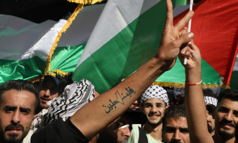 Palestinian supporters protesting in the Middle East showing solidarity with Gaza