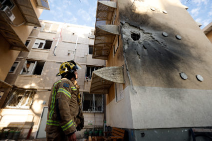 A damaged home is seen after it was hit by a rocket launched from the Gaza Strip into Israel, in Sderot, southern Israel