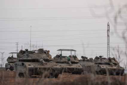 Israeli tanks are positioned near Israel's border with the Gaza Strip, in southern Israel