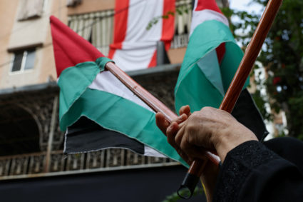 Supporters of Lebanon's Hezbollah hold a rally to express solidarity with Palestinians, in Beirut's southern suburbs