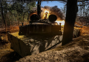 Ukrainian servicemen fire a self propelled howitzer towards Russian troops in the Donetsk region