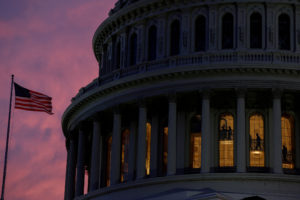 FILE PHOTO: People walk inside the upper floors of the rotunda of the U.S. Capitol building at sunset at the U.S. Capitol in Washington, U.S., January 4, 2023 Photo by Evelyn Hockstein/Reuters