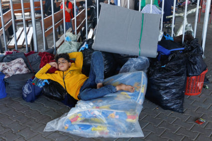 Palestinians with dual citizenship wait at the Rafah border crossing with Egypt, in the hope of getting permission to leav...