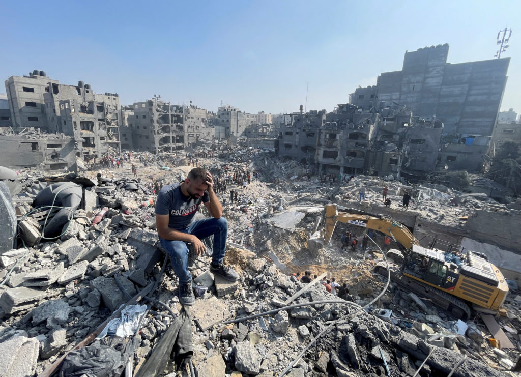 Palestinians search for casualties a day after Israeli strikes on houses in Jabalia refugee camp