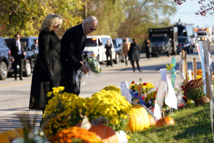 U.S. President Joe Biden and first lady Jill Biden lay flowers at a memorial at Schemengees Bar &amp; Grille Restaurant, one of the locations of the deadly mass shootings, as he pays respects to the victims, in Lewiston, Maine, U.S., November 3, 2023. Photo by Kevin Lamarque/REUTERS