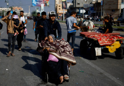 Palestinians flee north Gaza towards the south, amid the ongoing conflict between Israel and Palestinian Islamist group Ha...