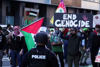 A person holds a Palestinian flag at a protest near the Moscone Center, during the APEC (Asia-Pacific Economic Cooperation) Summit, in San Francisco, California, U.S. November 12, 2023. Photo by Carlos Barria/REUTERS