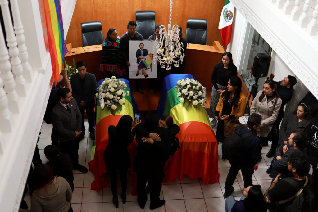 People hug during a tribute to Mexico's first openly non-binary magistrate and LGBTQ activist, Ociel Baena, and their partner, Dorian Daniel Nieves Herrera, at the Electoral Court of the State of Aguascalientes, in Aguascalientes, Mexico. November 14, 2023. Photo by Edgar Chavez/REUTERS