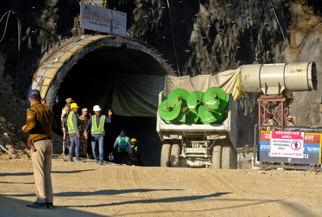 A supply truck loaded with augers prepares to enter a tunnel where 40 road workers are trapped after a portion of the tunn...