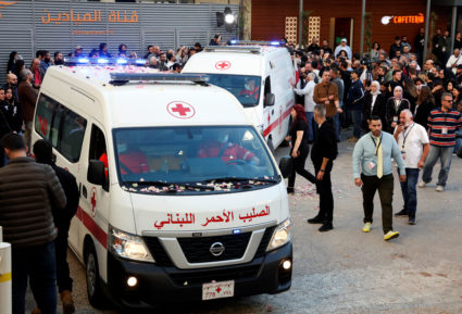 Ambulances carrying the bodies of the two journalists of Lebanon-based Al Mayadeen TV channel, drive outside the channel's...