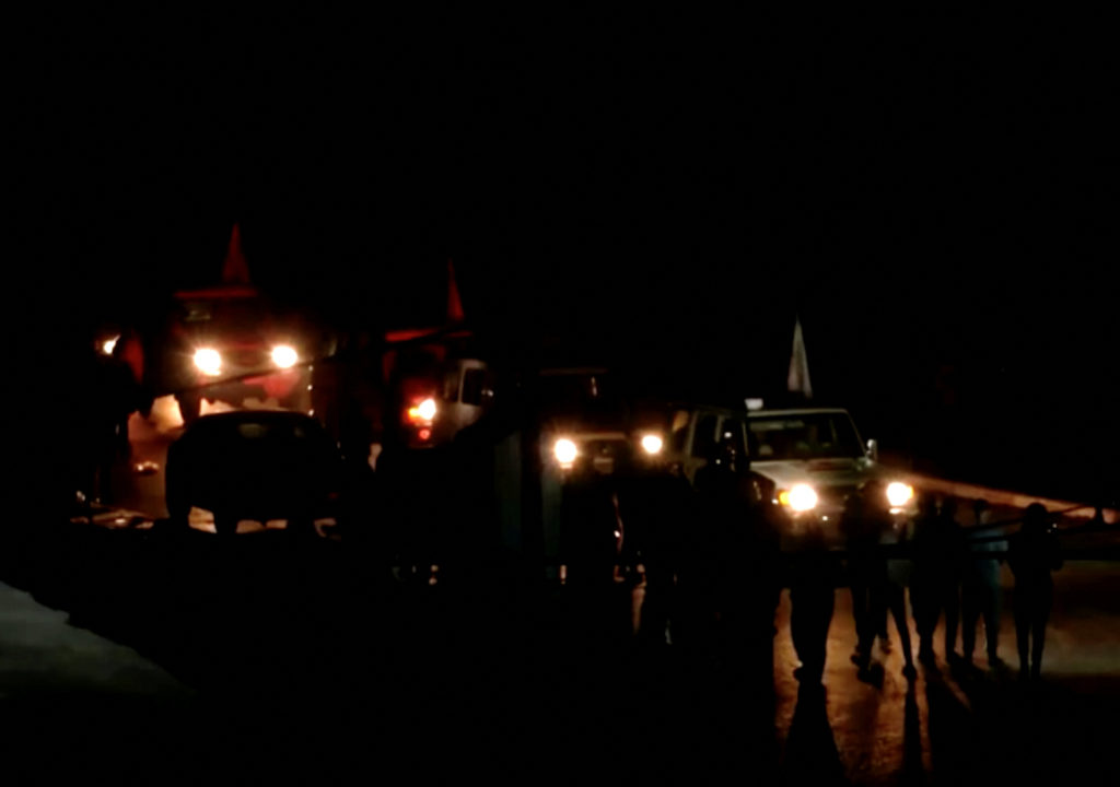 A convoy of vehicles believed to be carrying hostages abducted by Hamas militants during the October 7 attack on Israel ar...