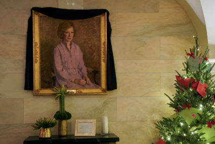 Black sash is draped over a portrait of late former U.S. first lady Rosalynn Carter at the White House in Washington
