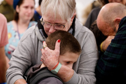 Tal Goldstein-Almog, 9, who was released from the Gaza Strip on November 26 after being taken hostage by the Palestinian militant group Hamas during the October 7 attack on Israel, is embraced by a loved one shortly after being reunited with his family, at Schneider Children's Medical Center of Israel in Petah Tikva, Israel on November 27, 2023. Photo by Schneider Children's Medical Center of Israel/Handout via REUTERS