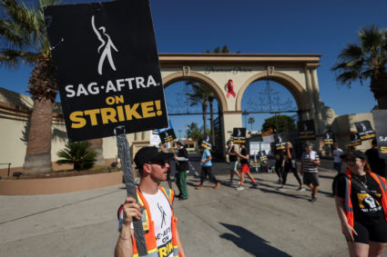 SAG-AFTRA members walk the picket line during their ongoing strike, in Los Angeles